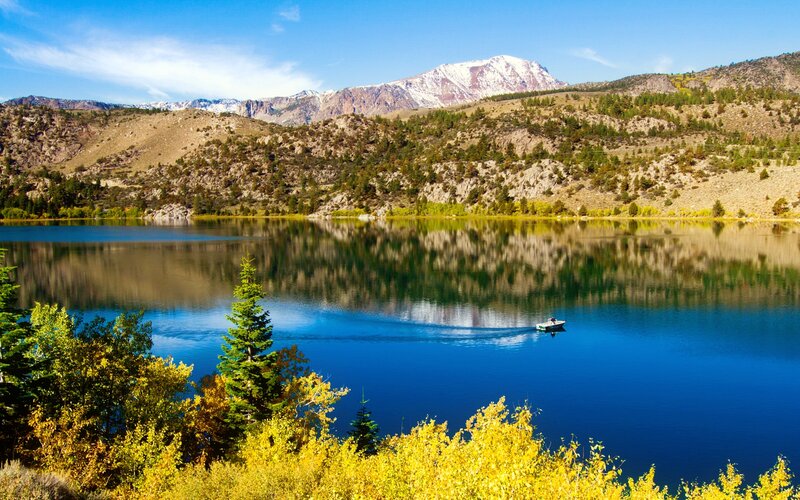 Boat on Lake with Mountains — Blue