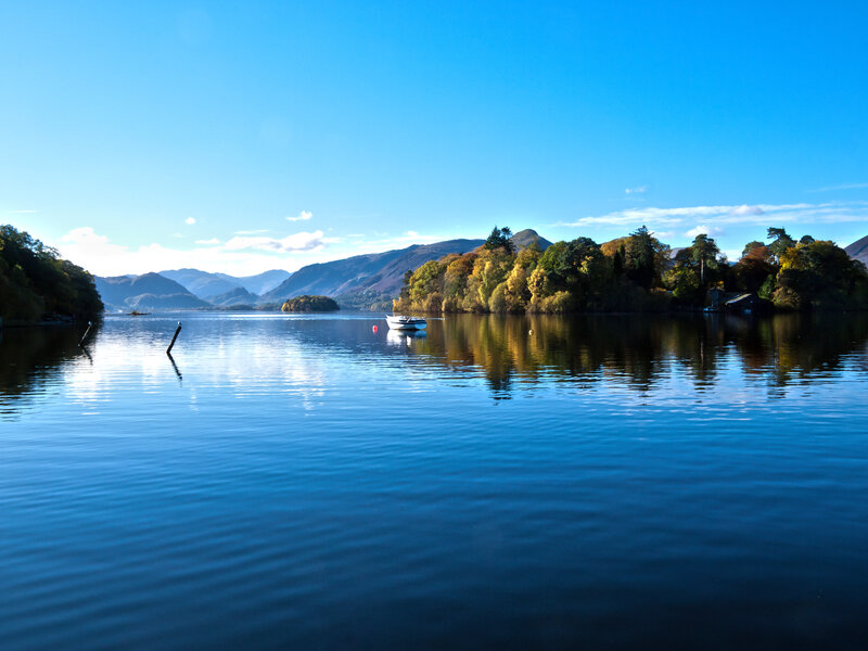 Boat on Lake with Mountains