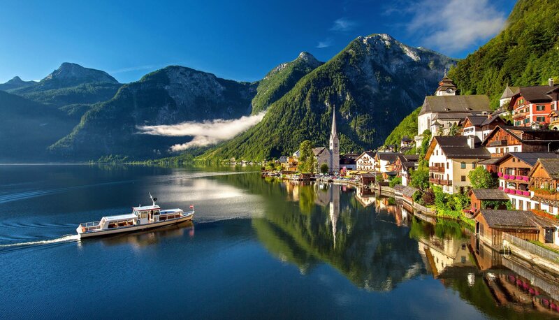 Boat on Lake with Village