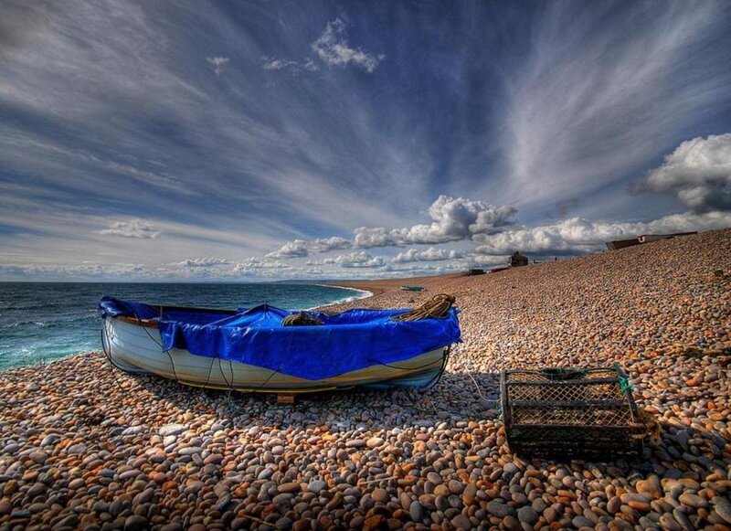 Boat on Pebble Beach — Blue, Dramatic, Afternoon