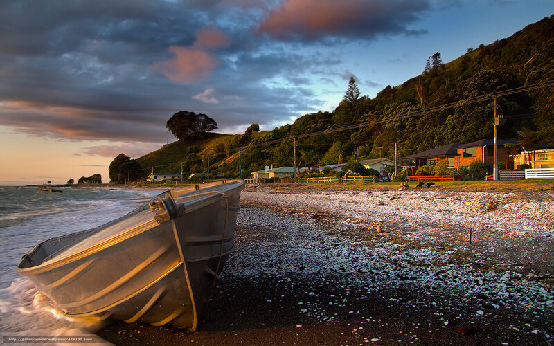 Boat on Pebble Beach — Blue, Dramatic, Sunset, Photograph, Houses