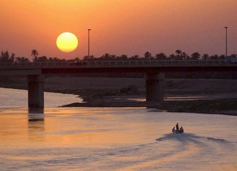 Boat on River at Sunset — Orange, Serene, Photograph, Bridge