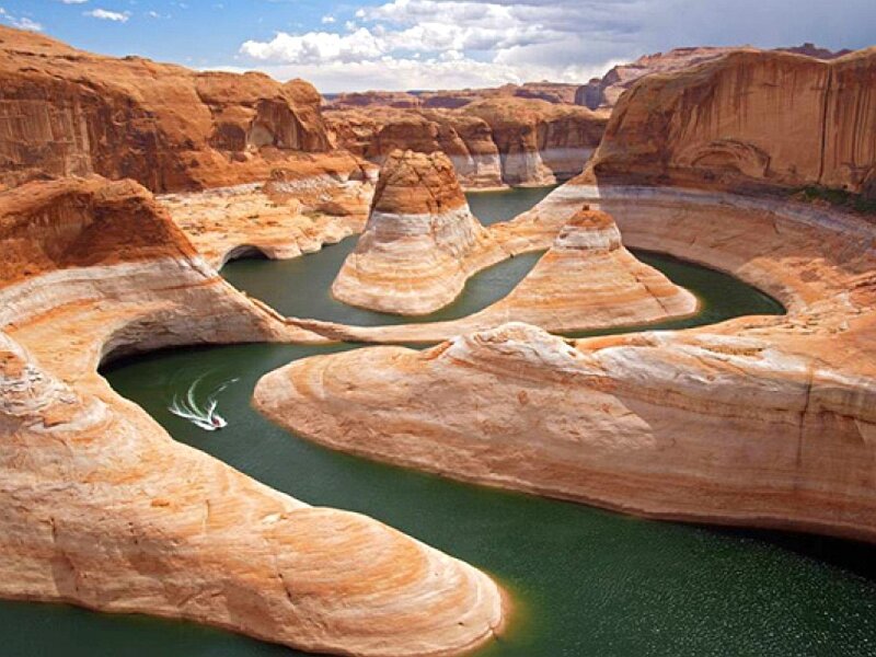 boat on river in canyon