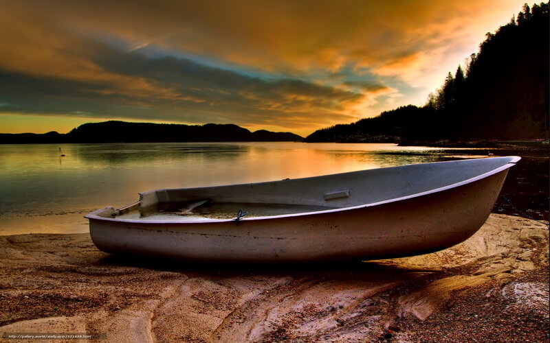 Boat on the shore at sunset