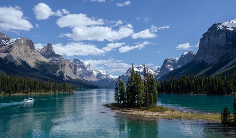 Boat on Turquoise Lake — Blue, Serene, Afternoon, Photograph, Mountains