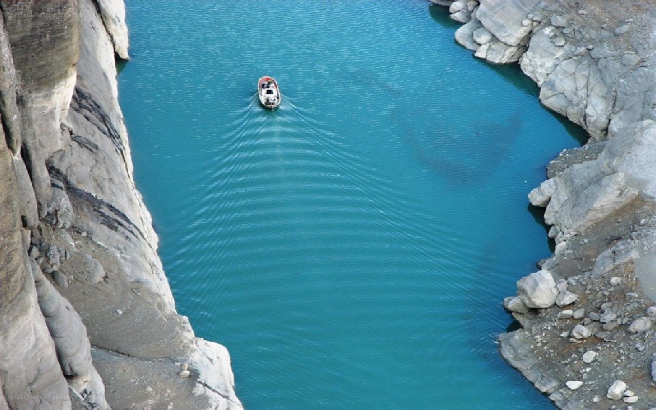Boat on turquoise lake
