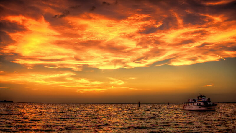 Boat on Water at Sunset — Orange, Dramatic, Photograph