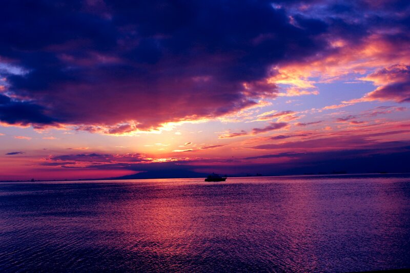 Boat on Water at Sunset — Purple