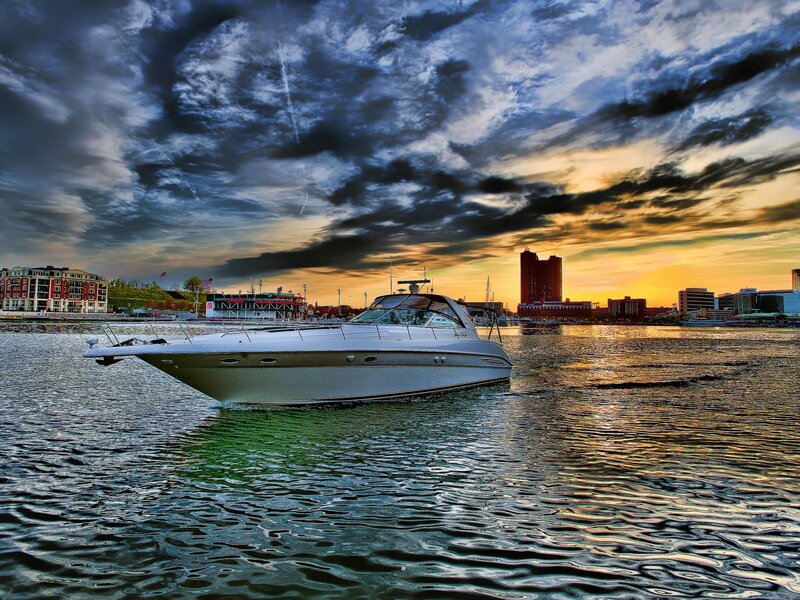 Boat on water at sunset