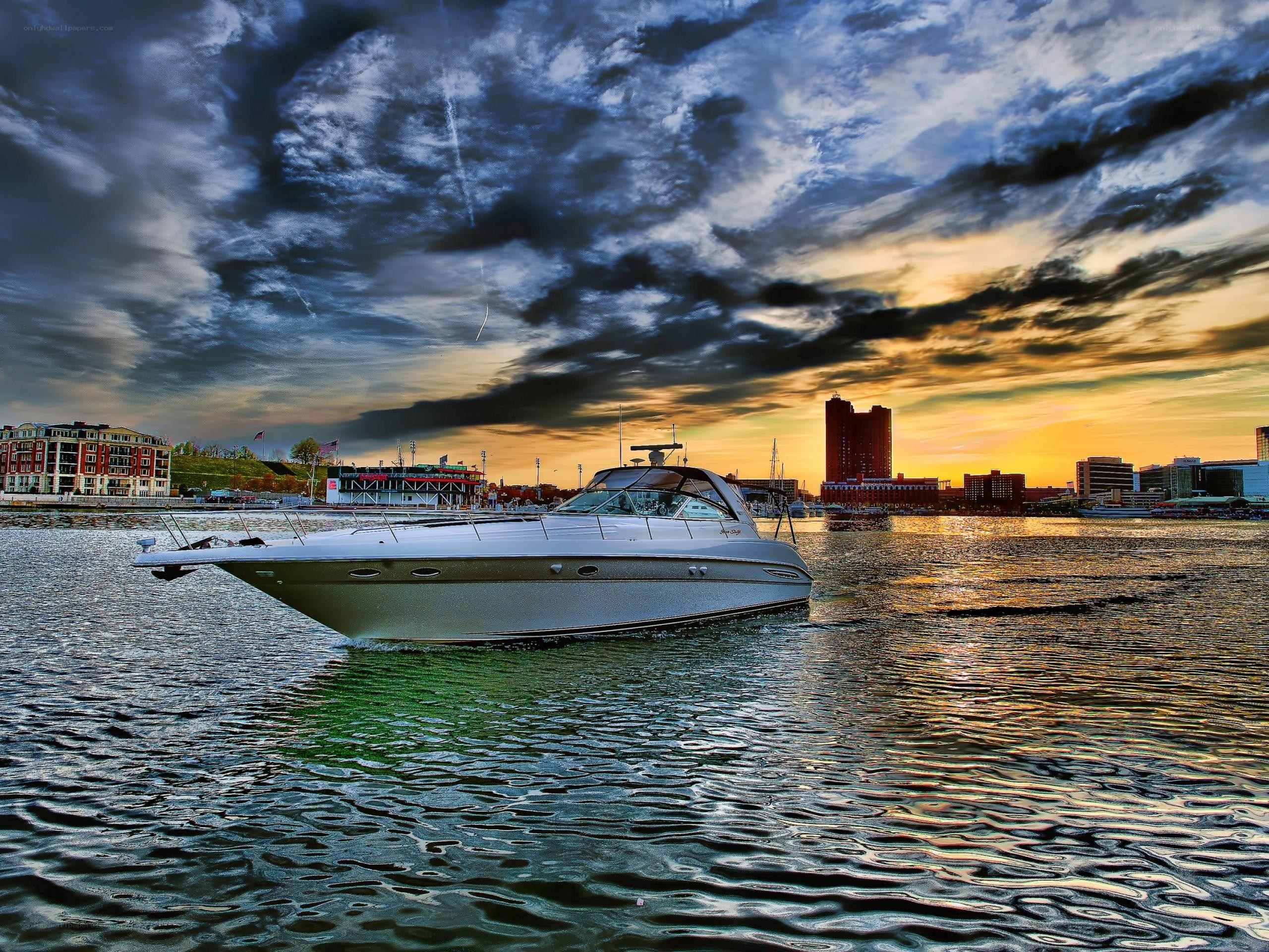 Boat on water at sunset