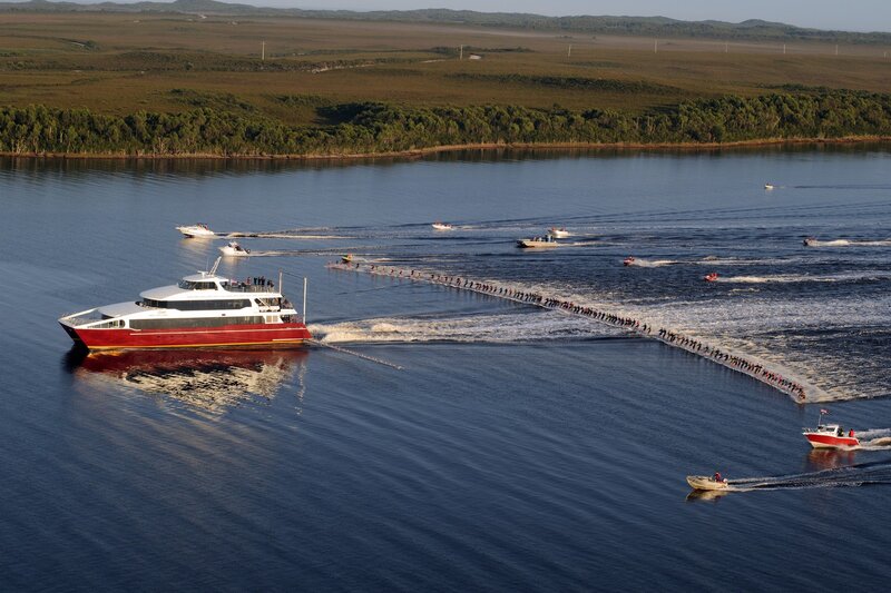 Boat pulling people on water