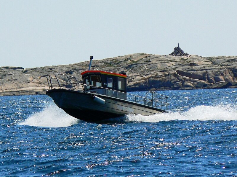 Boat speeding on blue water
