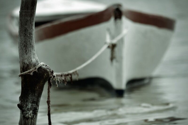 Boat tied to a post