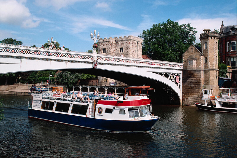 Boat under a stone bridge