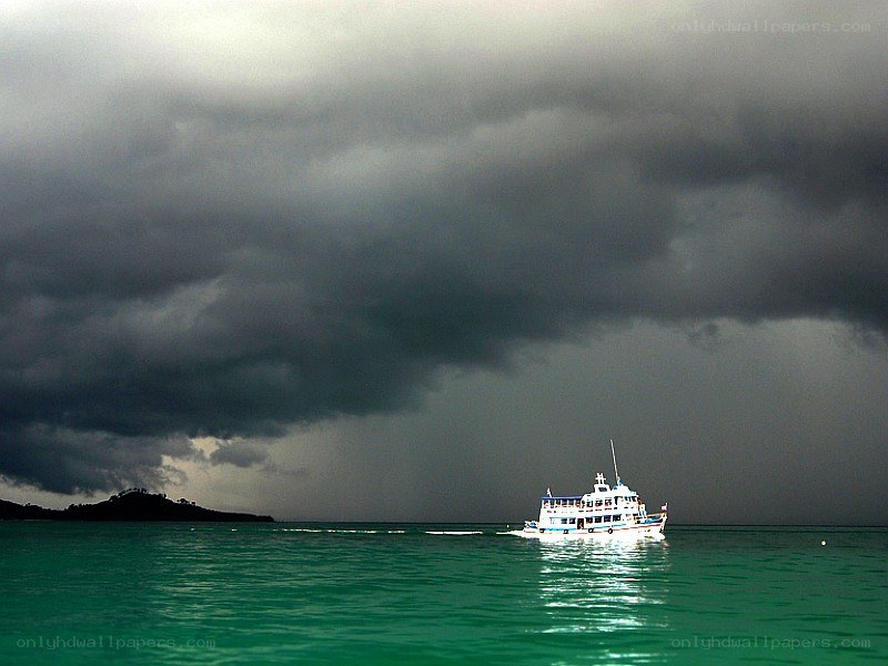 Boat under stormy sky