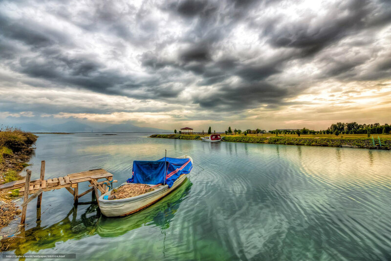 Boat under stormy sky