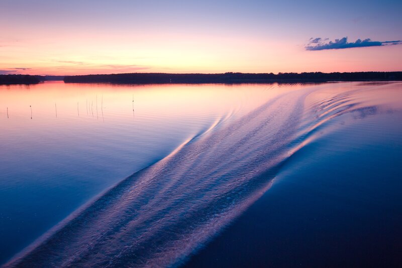 Boat wake at sunset