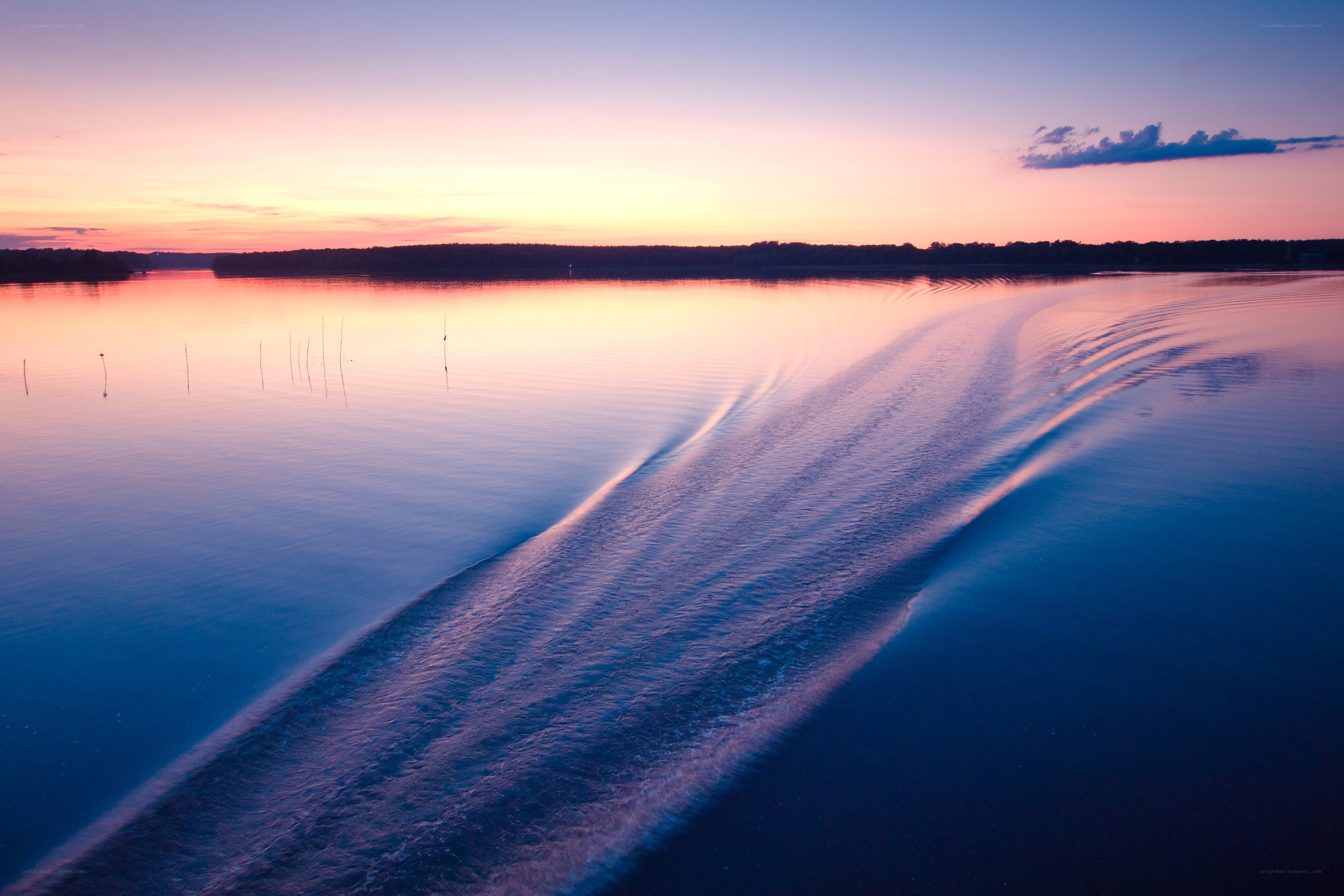 Boat wake at sunset