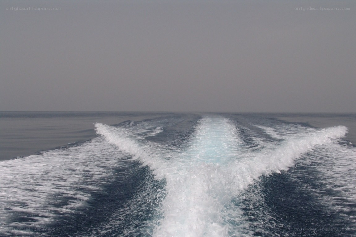 Boat wake on calm sea