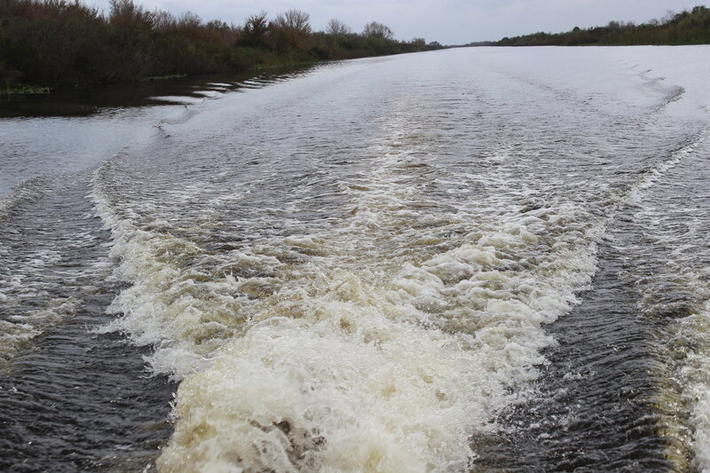 Boat Wake on River — Brown