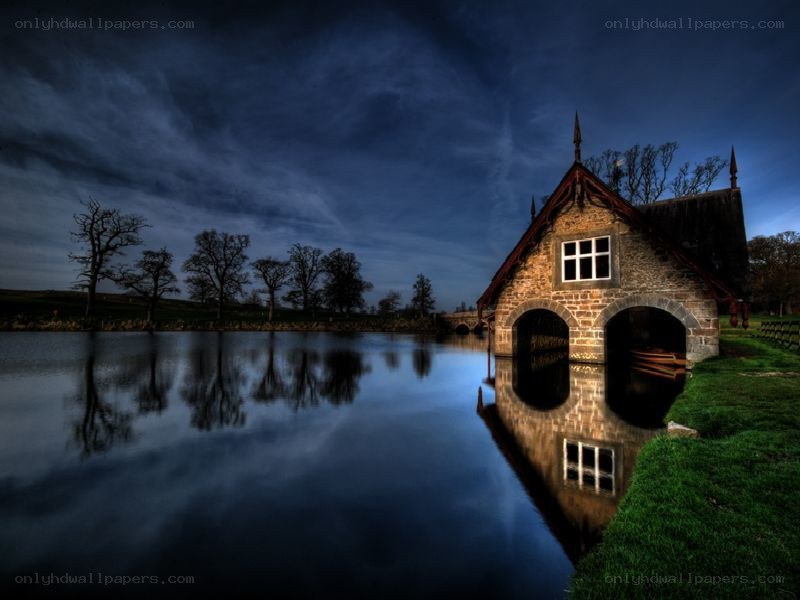 Boathouse at dusk by the river