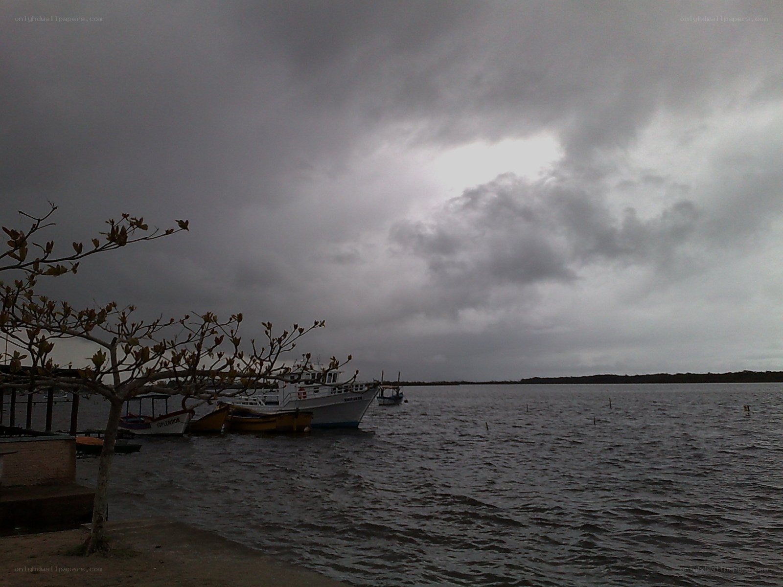 Boats at a cloudy waterfront