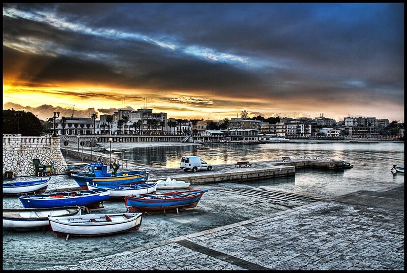 Boats at a coastal town harbor