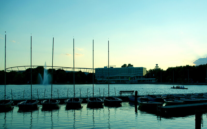 Boats at a lake with fountain