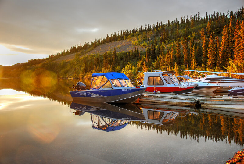 Boats at a Lakeside Dock — Blue, Serene, Sunset, Photograph, Lake