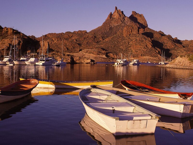 Boats at a mountainous harbor