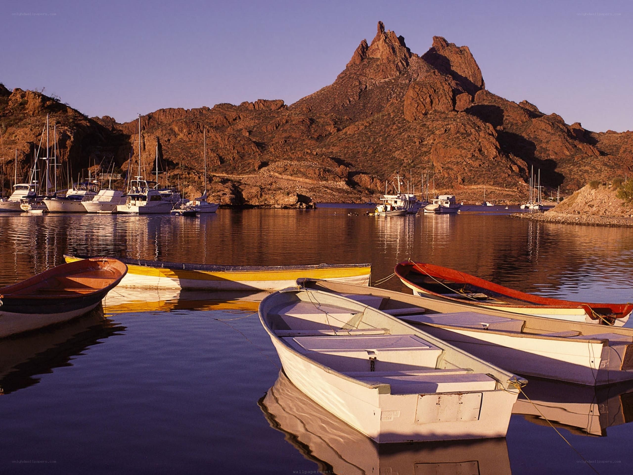 Boats at a mountainous harbor