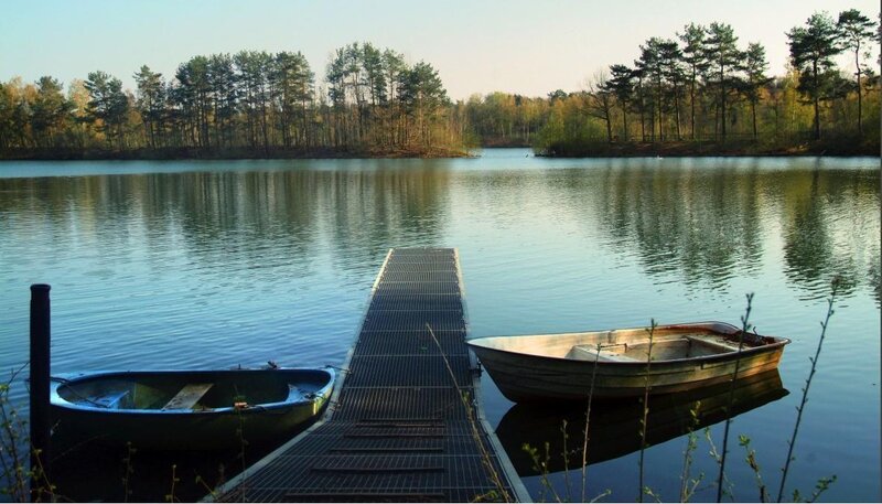 Boats at a quiet lakeside dock