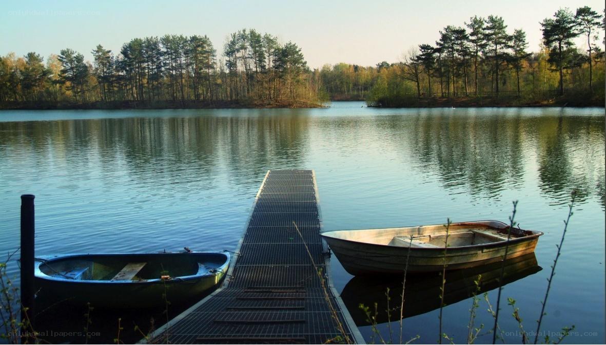Boats at a quiet lakeside dock