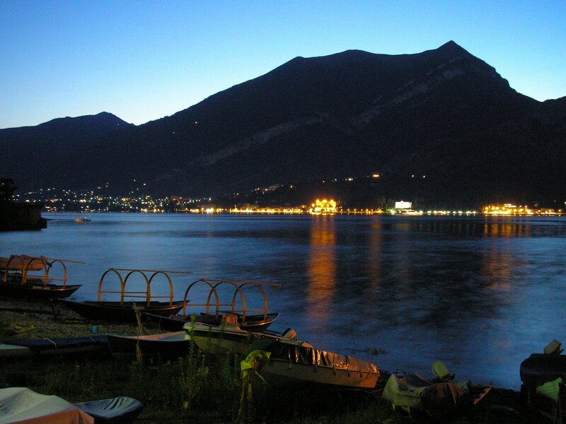 Boats at dusk by a lake