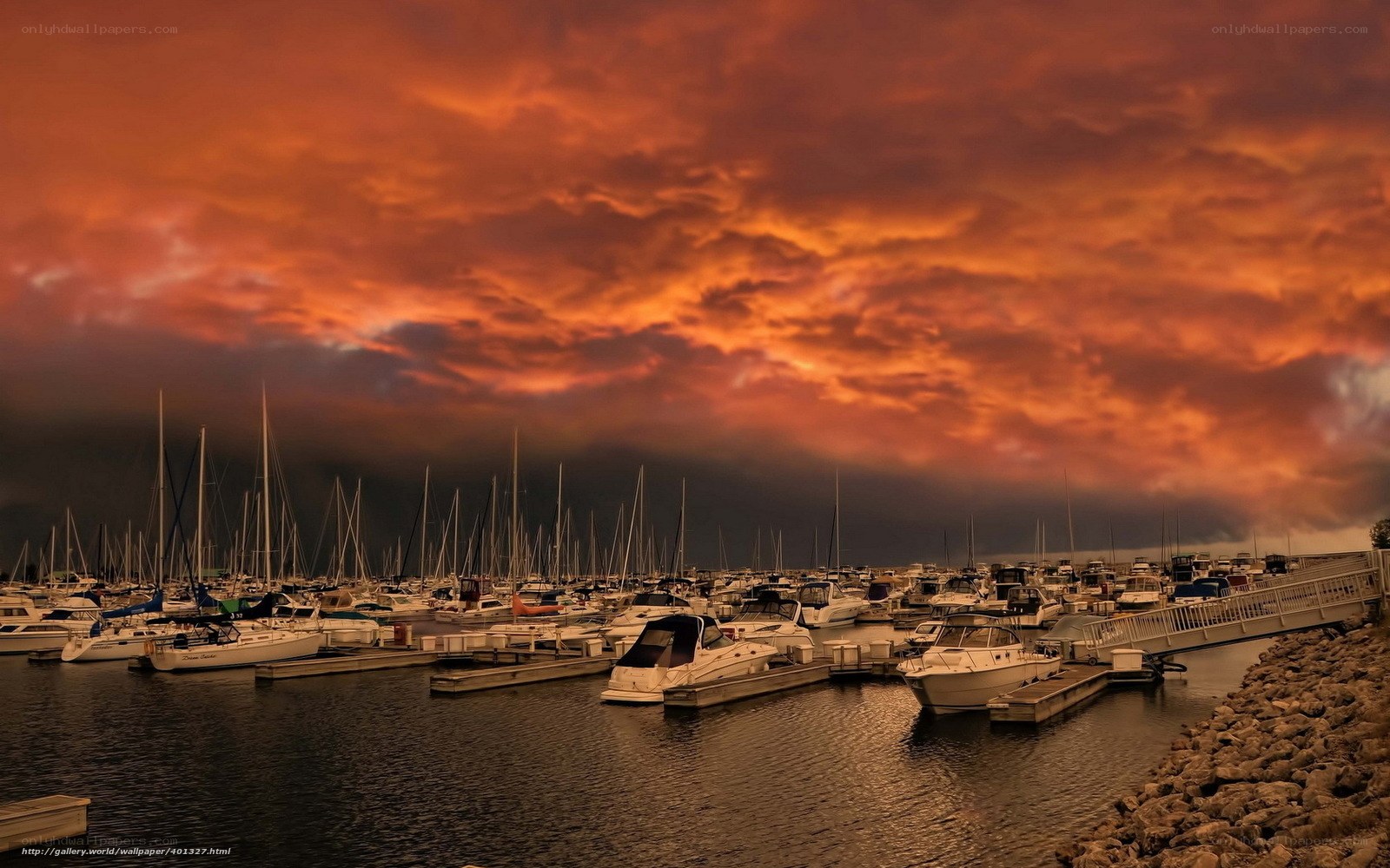 Boats at marina during sunset
