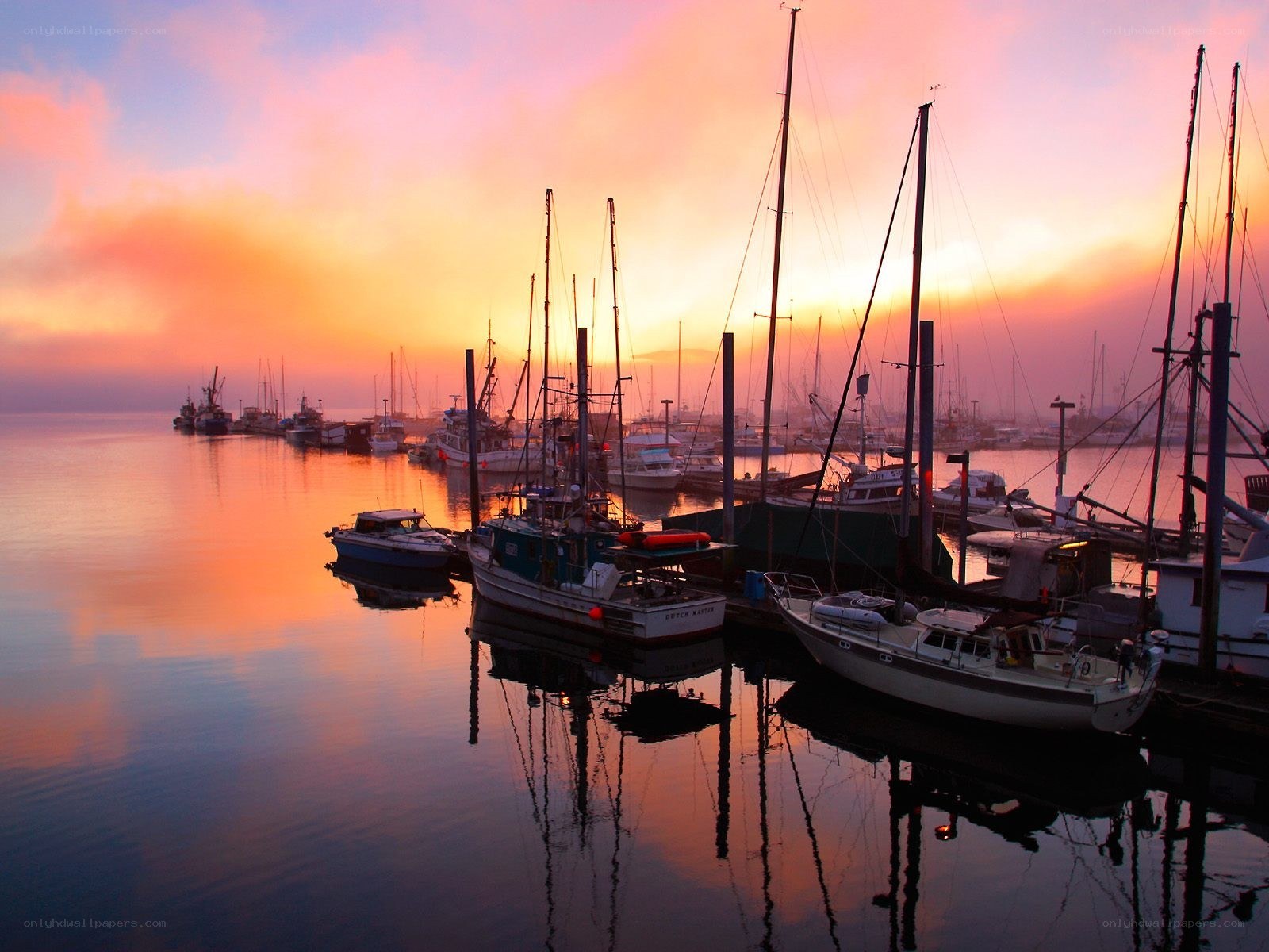 Boats at sunset in a harbor