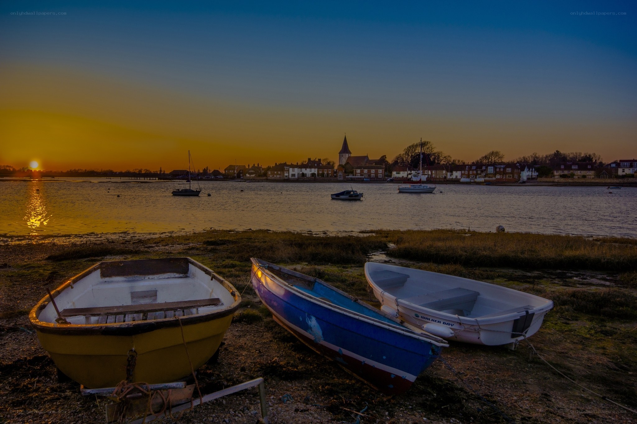 Boats at sunset on a river
