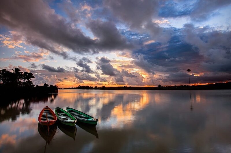 Boats at sunset on calm water