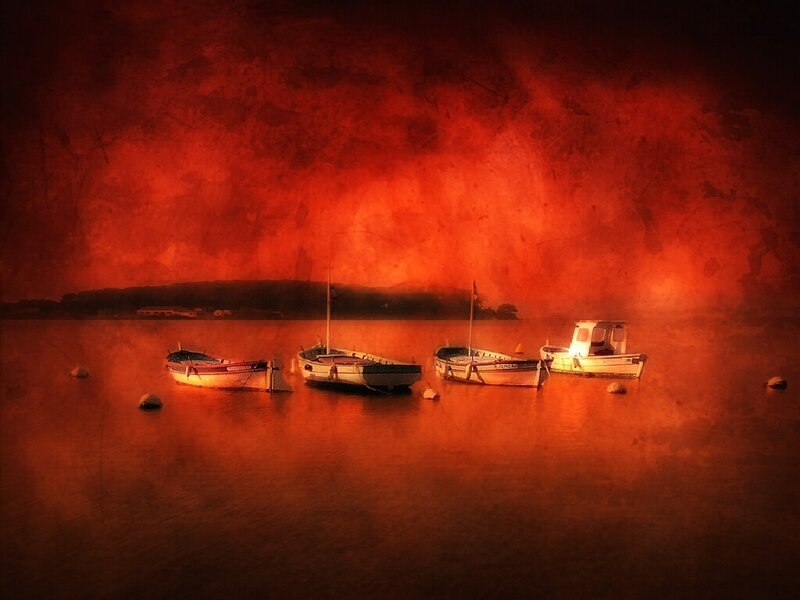 Boats at sunset on calm water