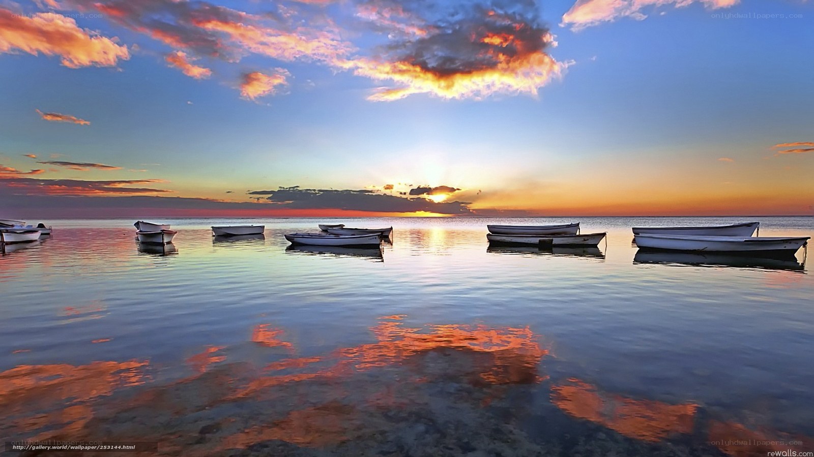 Boats at sunset on calm water