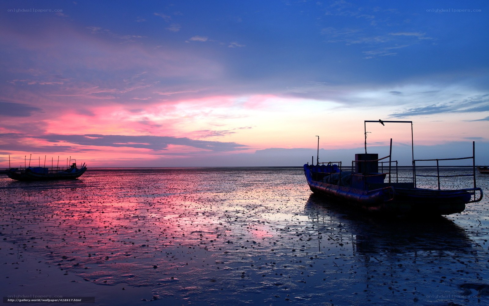 Boats at sunset on the shore