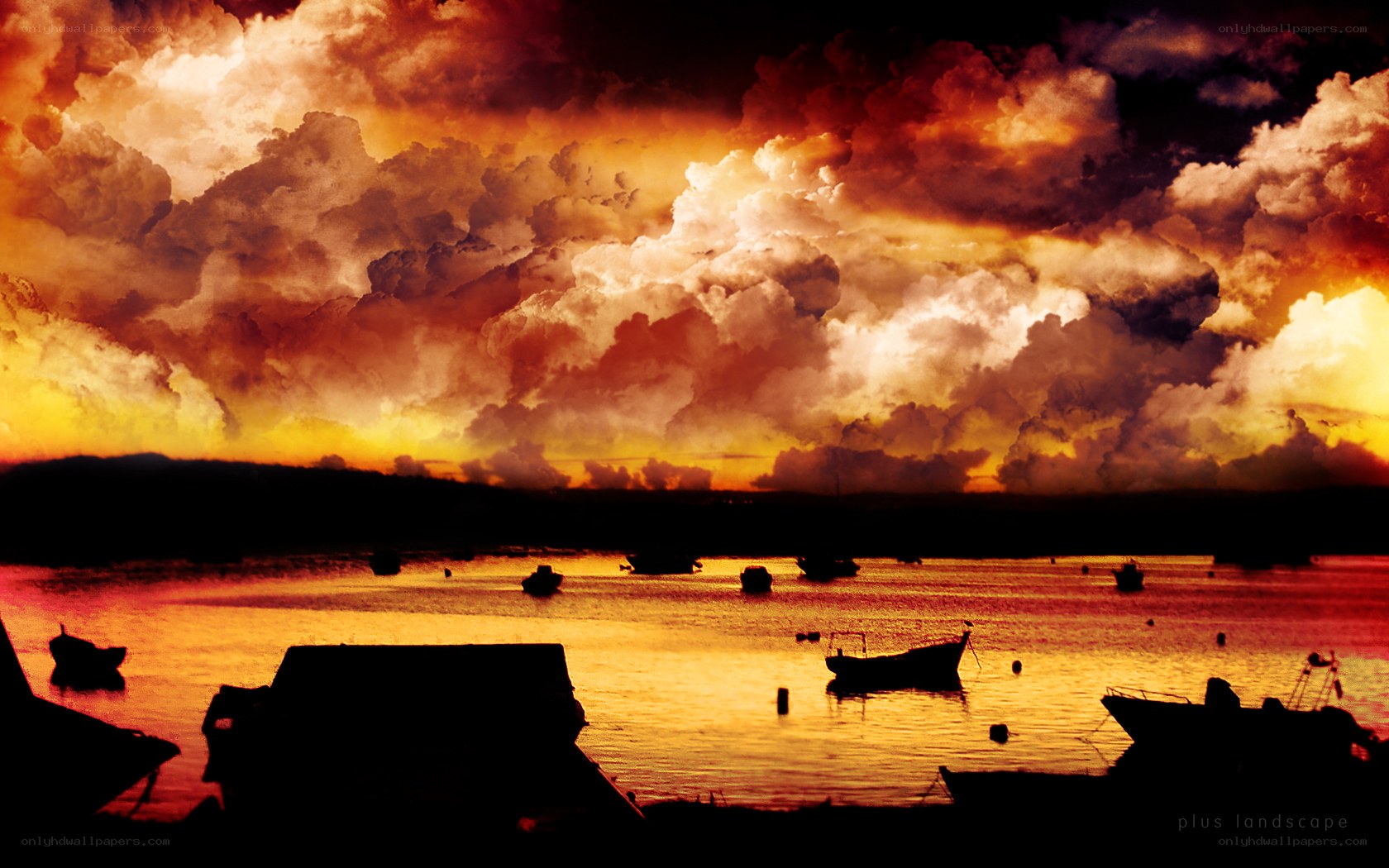 Boats at sunset over water