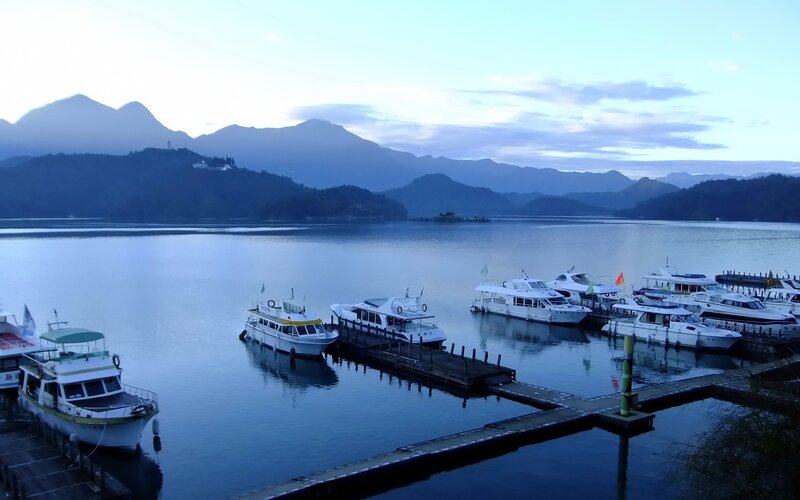 Boats docked at a lake