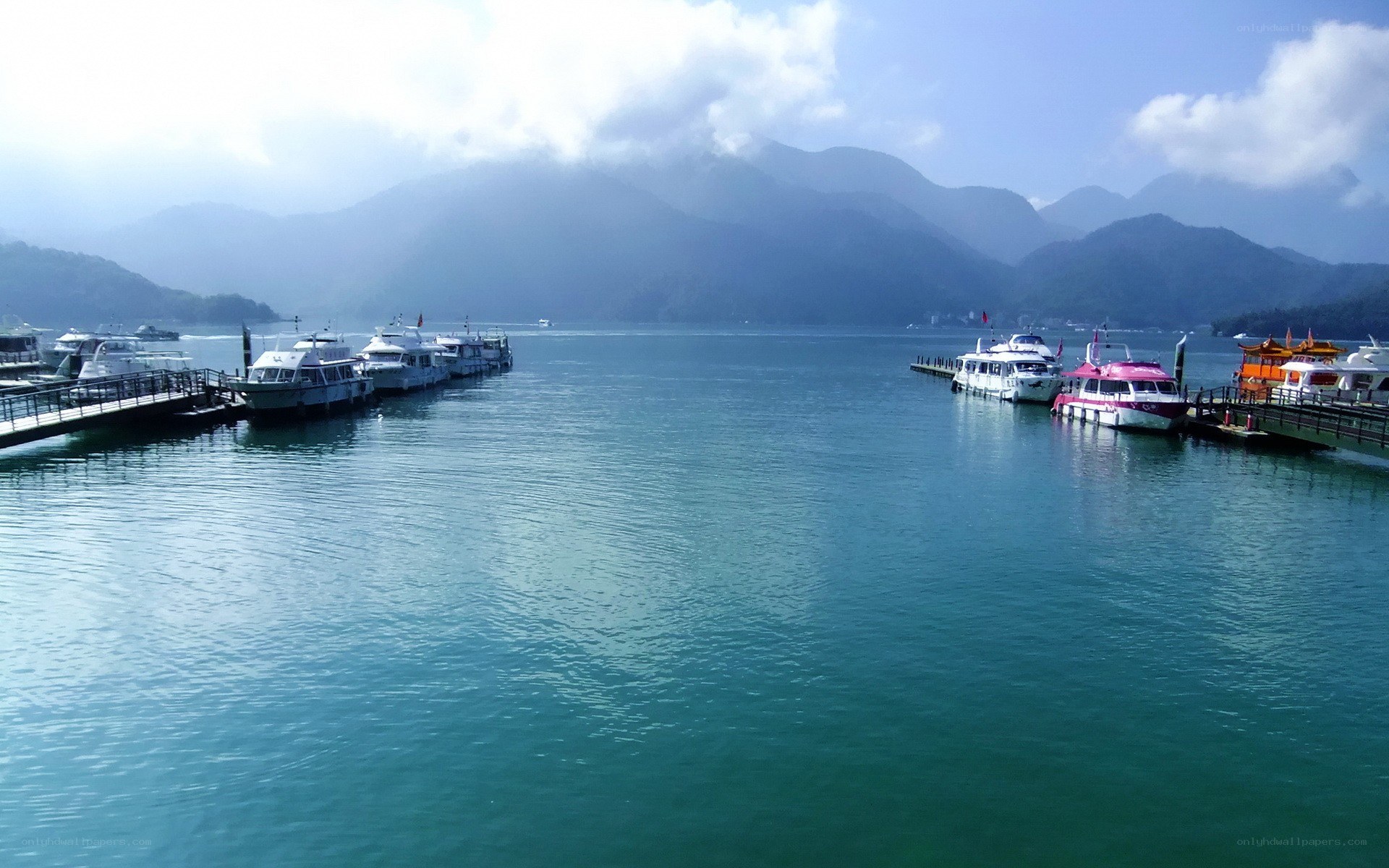 Boats docked at a lake
