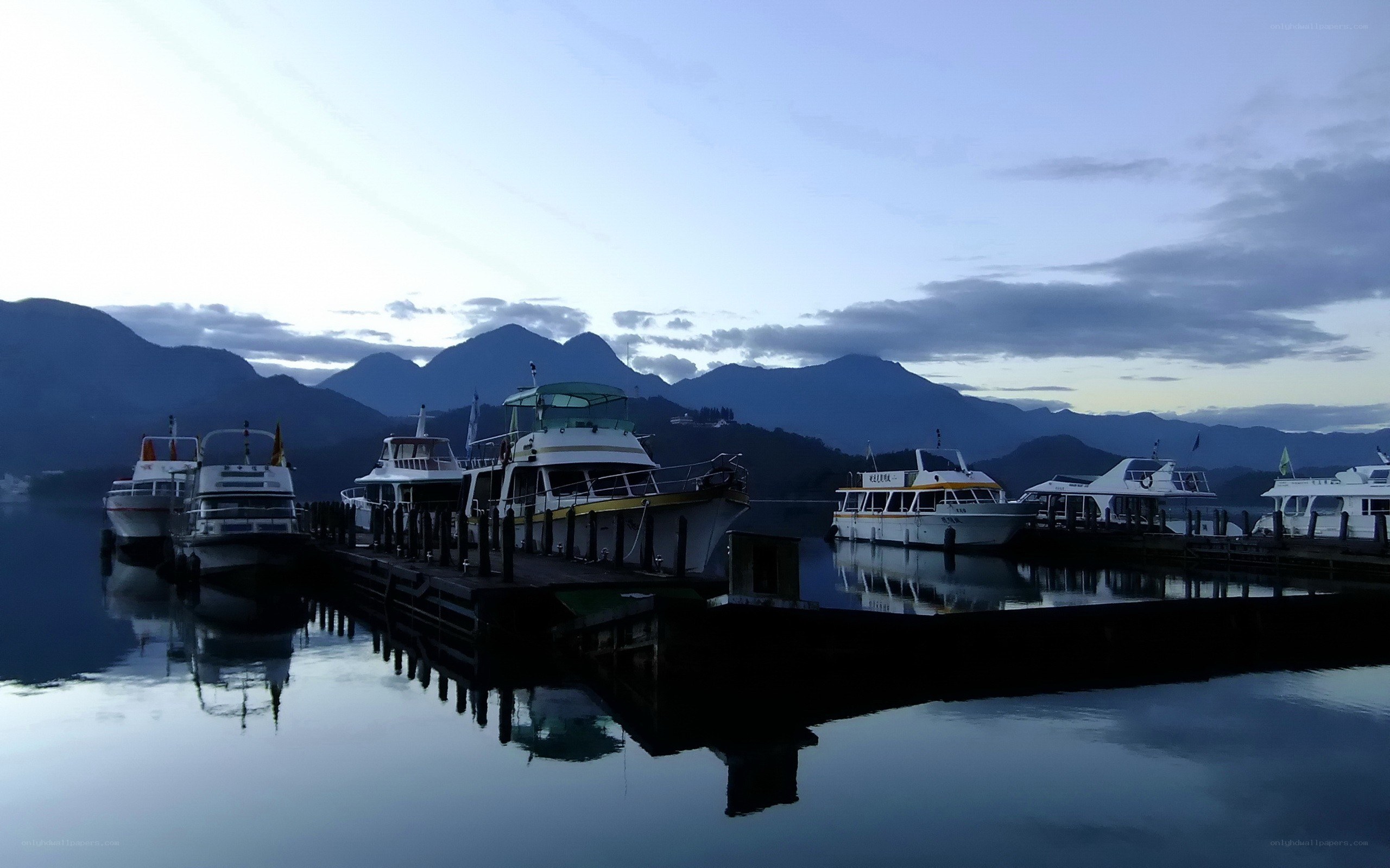 Boats docked at a lake