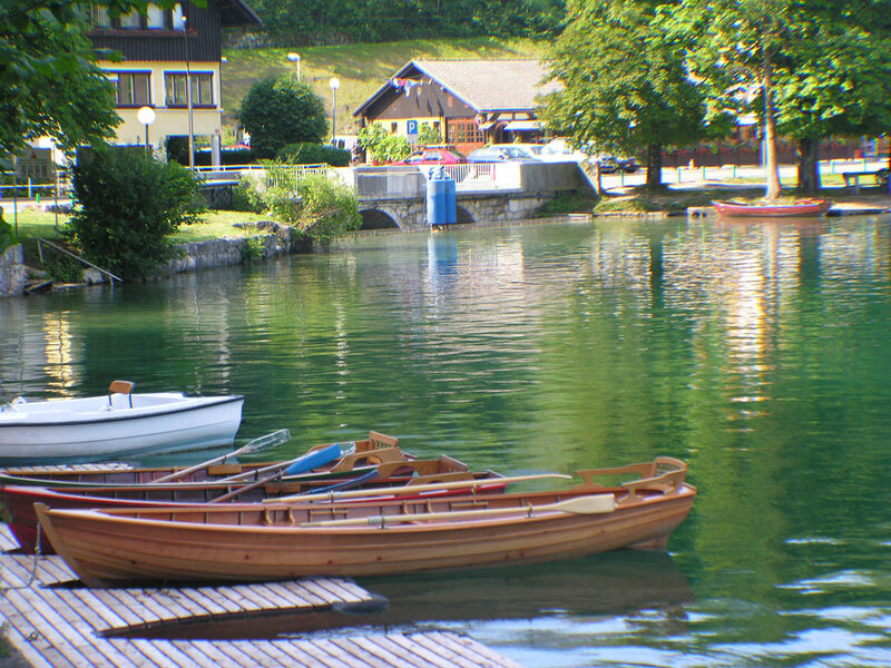 Boats docked at a lakeside village