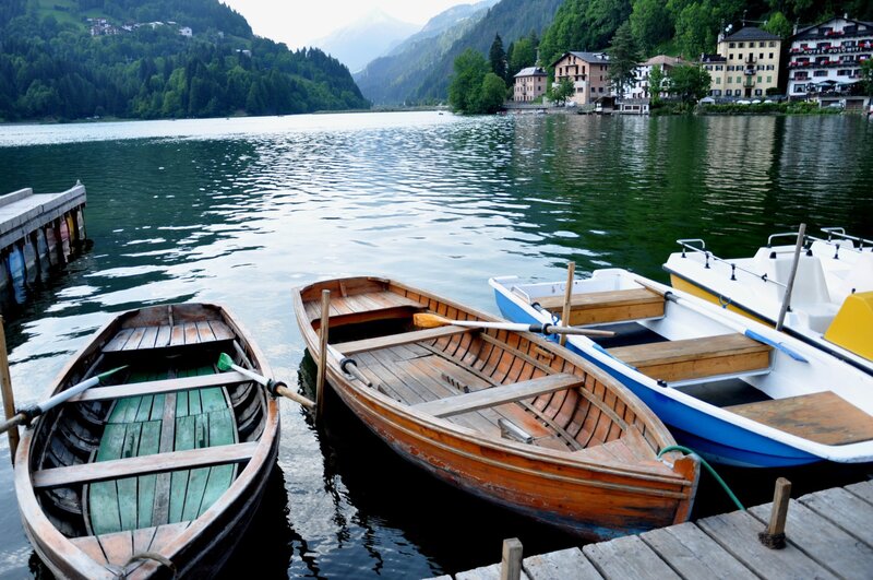 Boats docked at a lakeside village