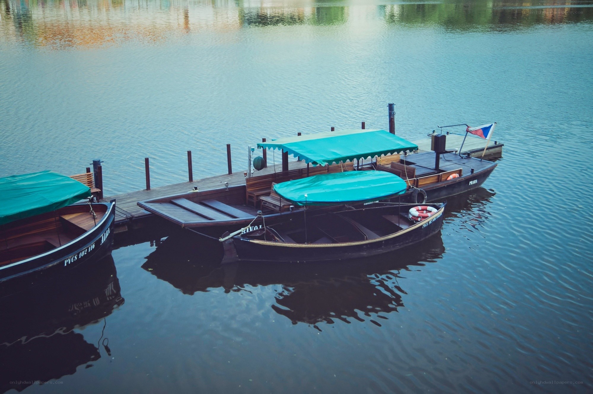 Boats docked at a pier