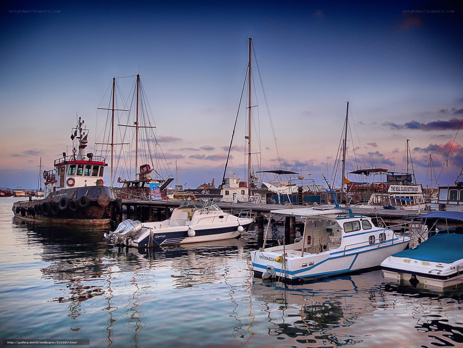 Boats docked at harbor