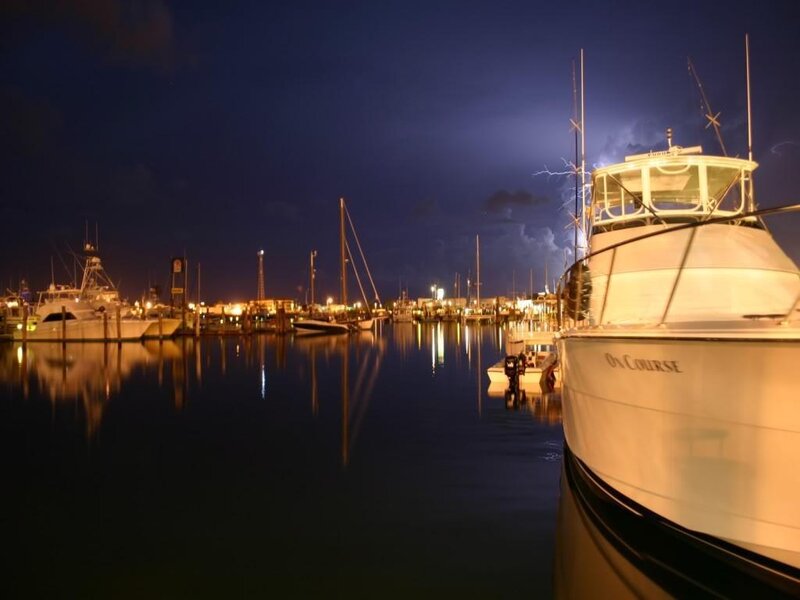 Boats docked at marina during storm